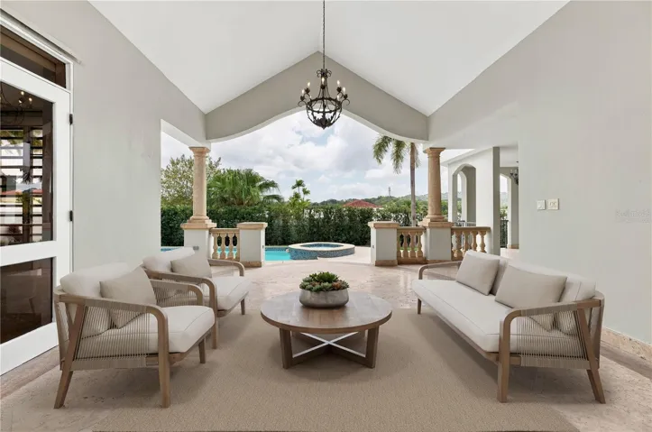 Covered Outdoor Space - This image has been virtually staged and does not reflect the current state of the property.