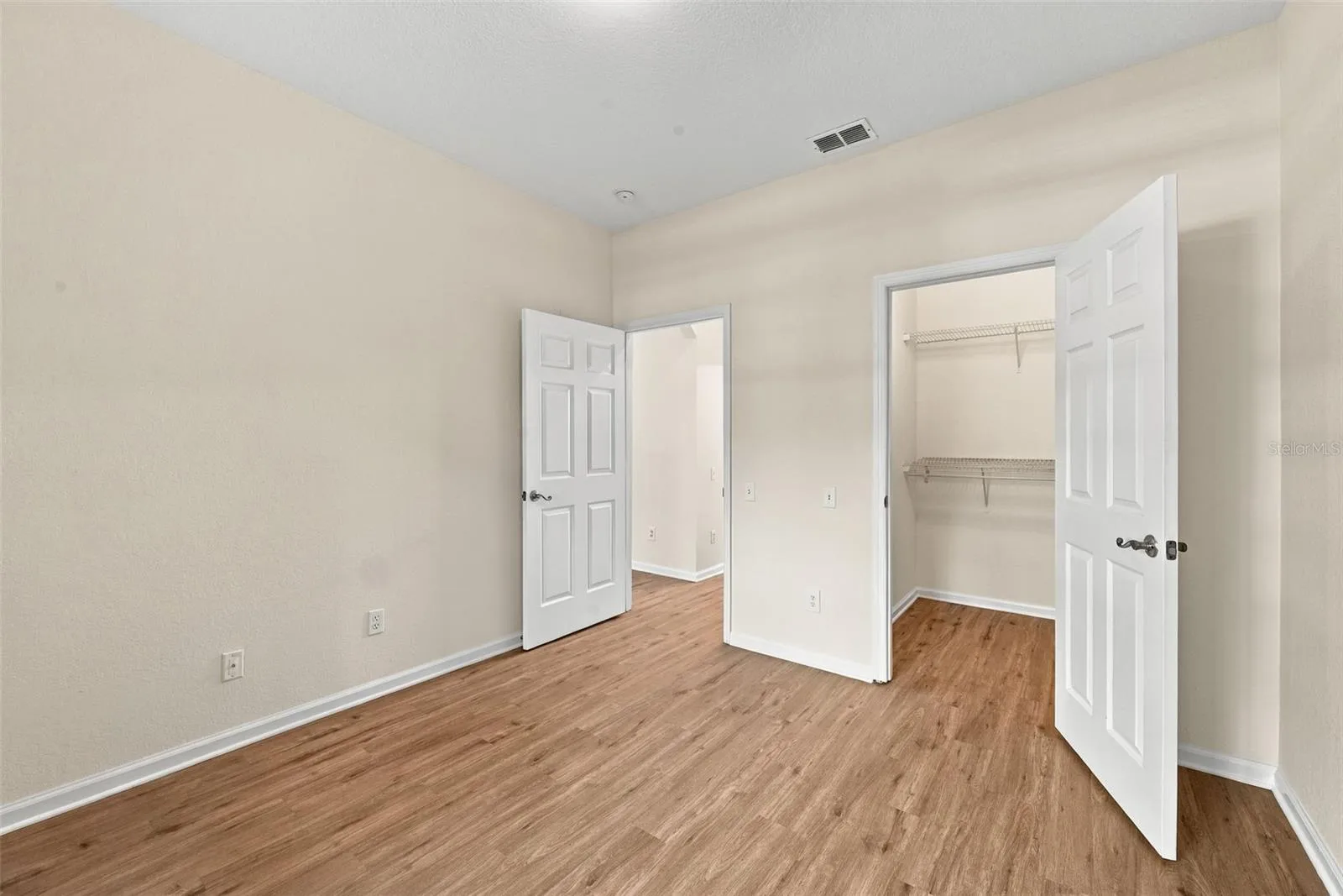 2nd bedroom- view of walking in closet