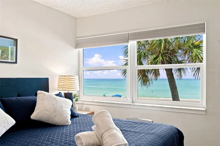 Primary bedroom with view of the beach