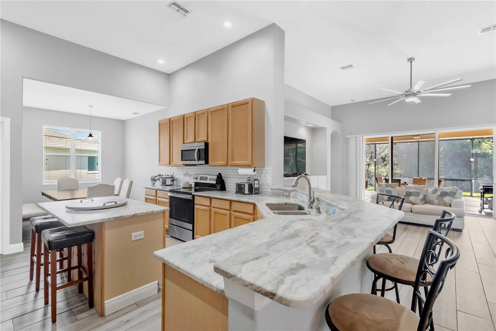 Open Kitchen with leathered countertops