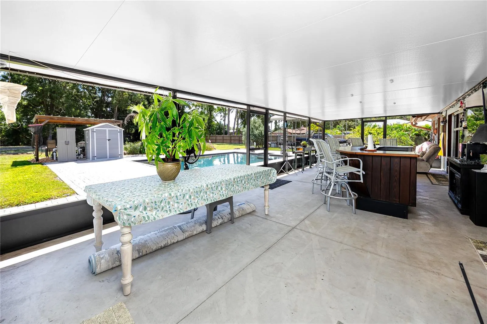 HUGE covered exterior patio and bar