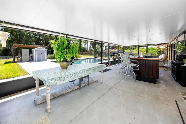 HUGE covered exterior patio and bar