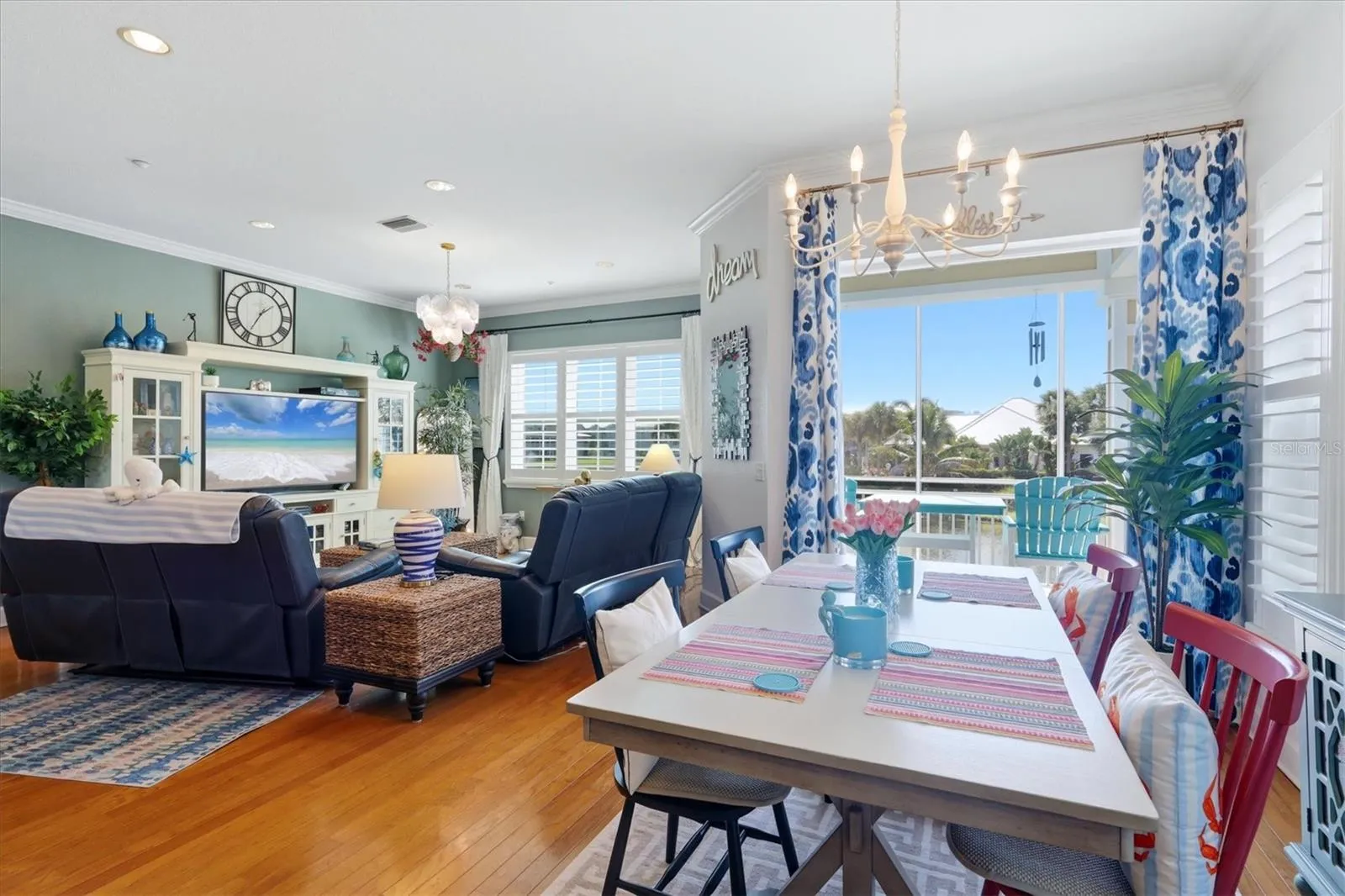 French doors flow onto the balcony overlooking lake &amp; pool