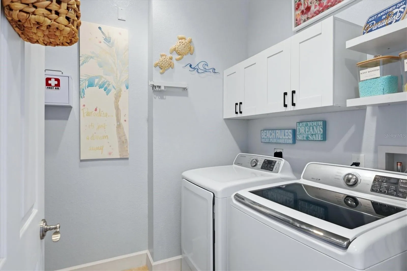 Laundry Room is located on upper level convenient to both Primary suites and includes a utility sink