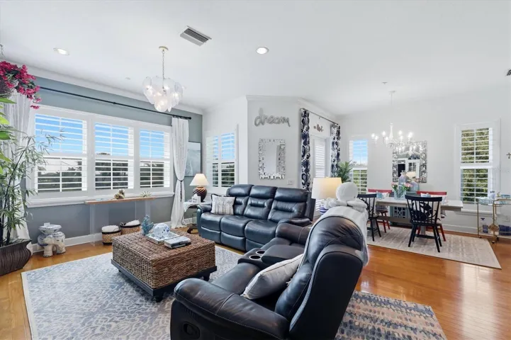 Living &amp; Dining areas accented with plantation shutters on the brand new impact-resistant windows &amp; doors