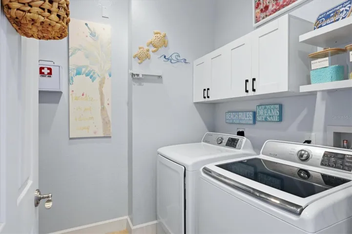 Laundry Room is located on upper level convenient to both Primary suites and includes a utility sink