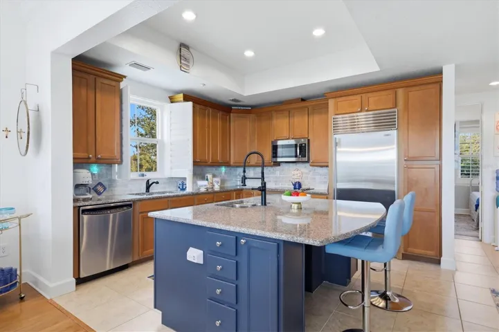 Kitchen features Sub-zero refrigerator and stainless appliances