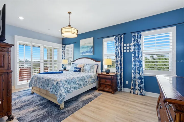Primary Suite with balcony overlooking lake