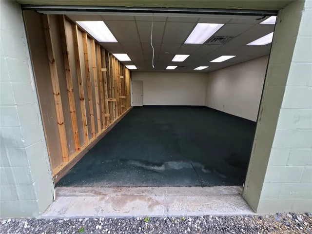 Out back, showing the roll up door area.