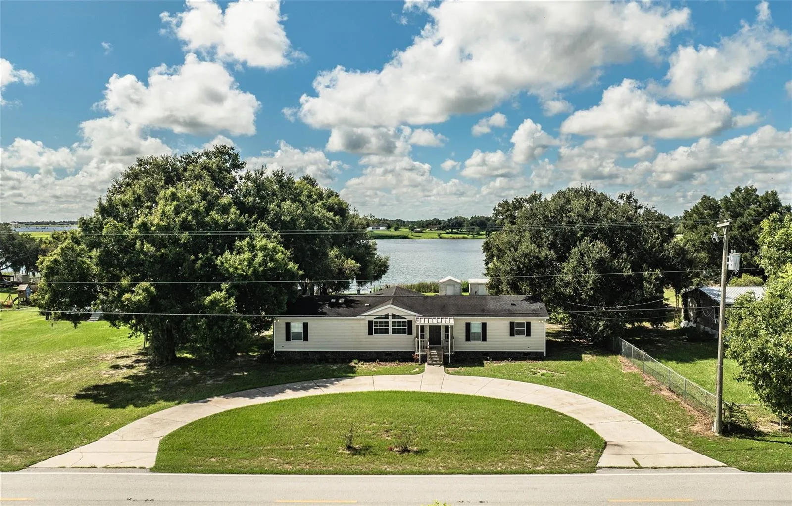 Front of house with view of Lake Walker