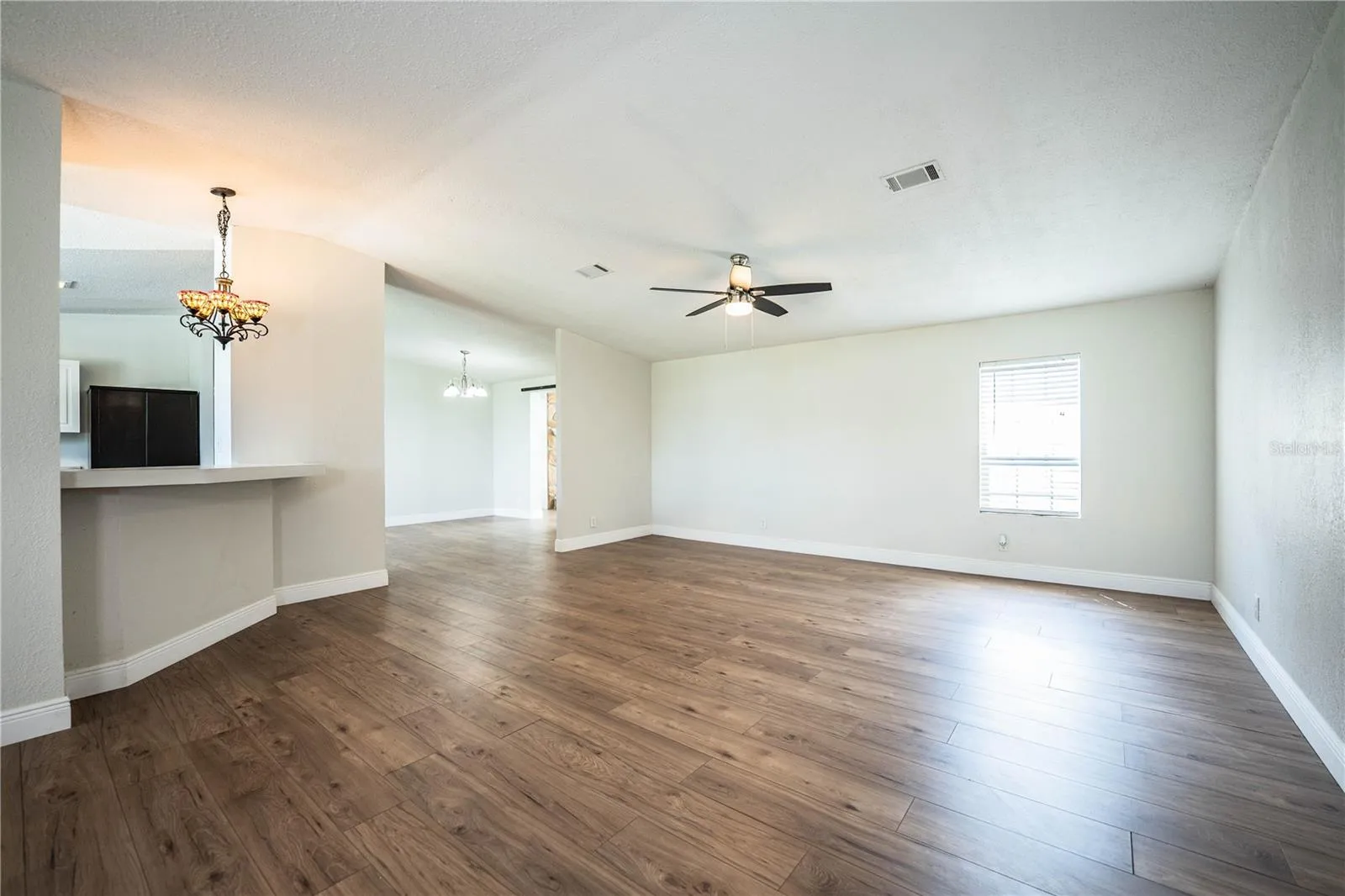 Living Room looking at kitchen and dining room
