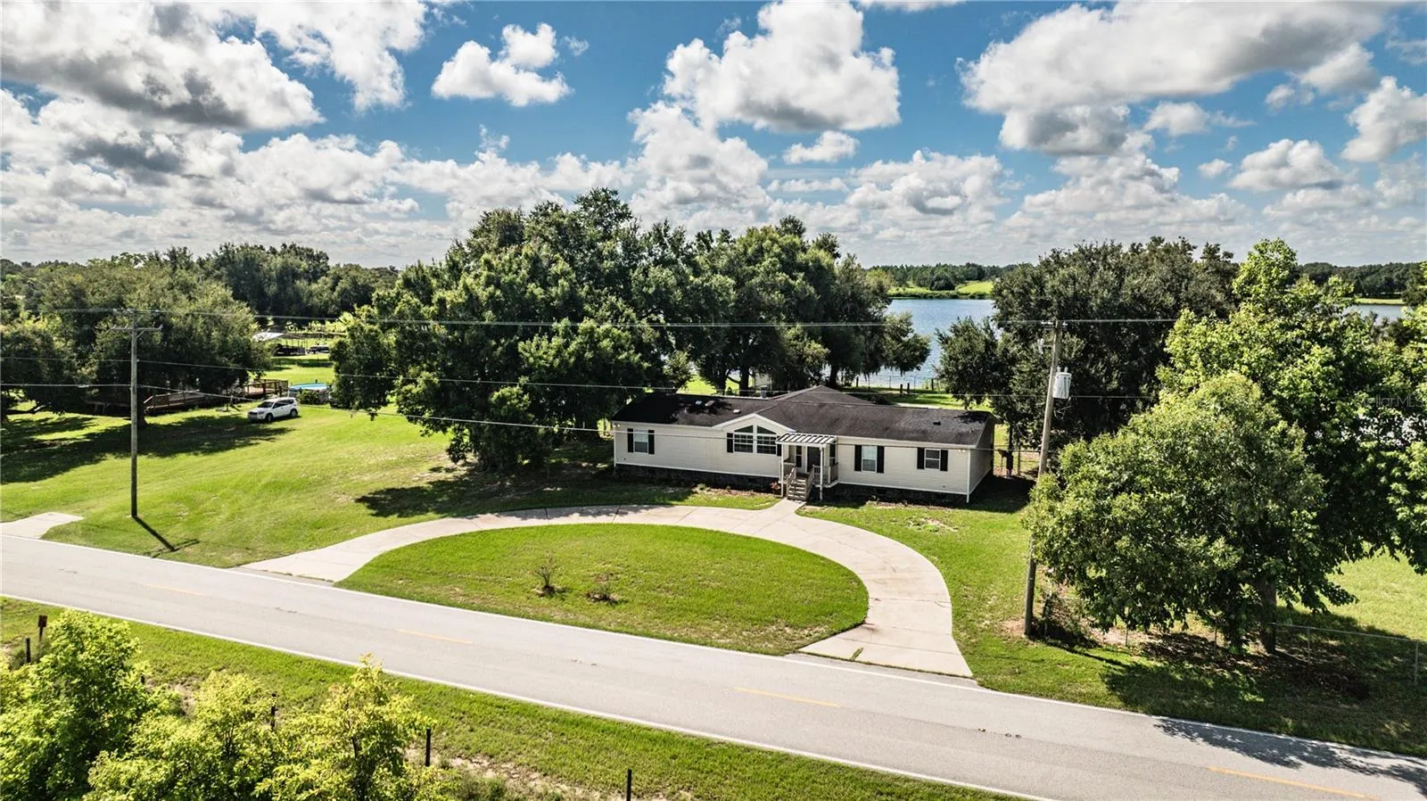 Front of house with view of Lake Walker