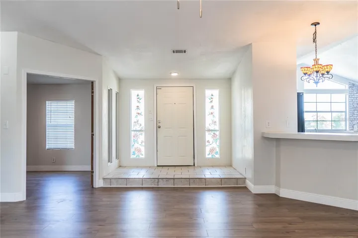 Living Room looking at entrance and bonus bedroom/nursery/office