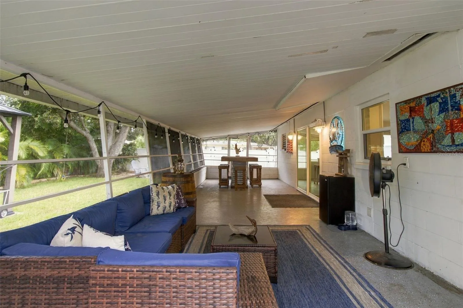 The back porch spans almost the width of the home!