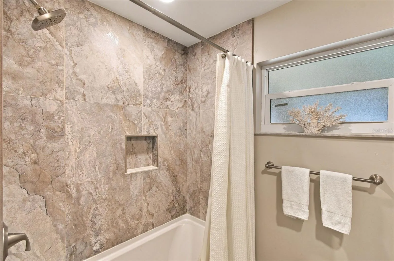 Tiled shower and tub enhances the 2nd bath