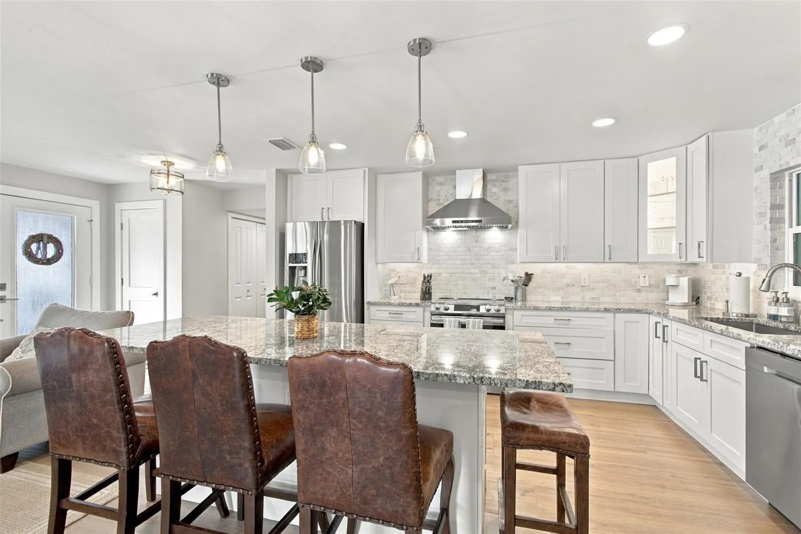 Stunning kitchen with all-wood 42 inch cabinetry, Samsung, stainless steel appliance package and level 2 stone counters.