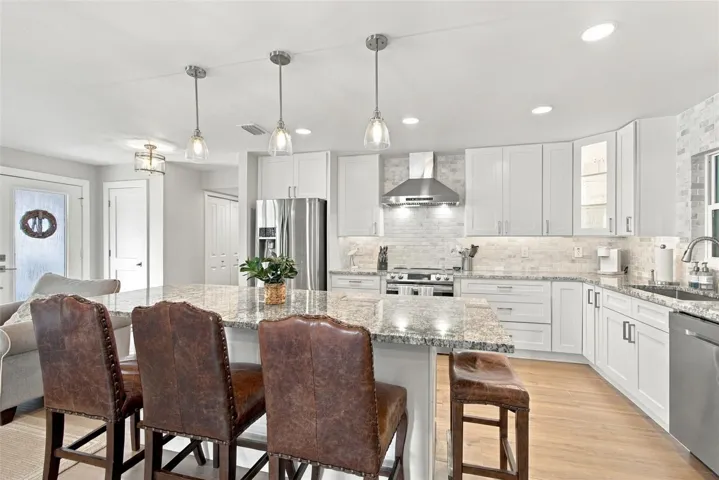 Stunning kitchen with all-wood 42 inch cabinetry, Samsung, stainless steel appliance package and level 2 stone counters.
