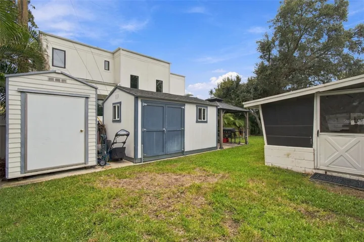 Plenty of extra storage out back plus workshoop and covered BBQ area