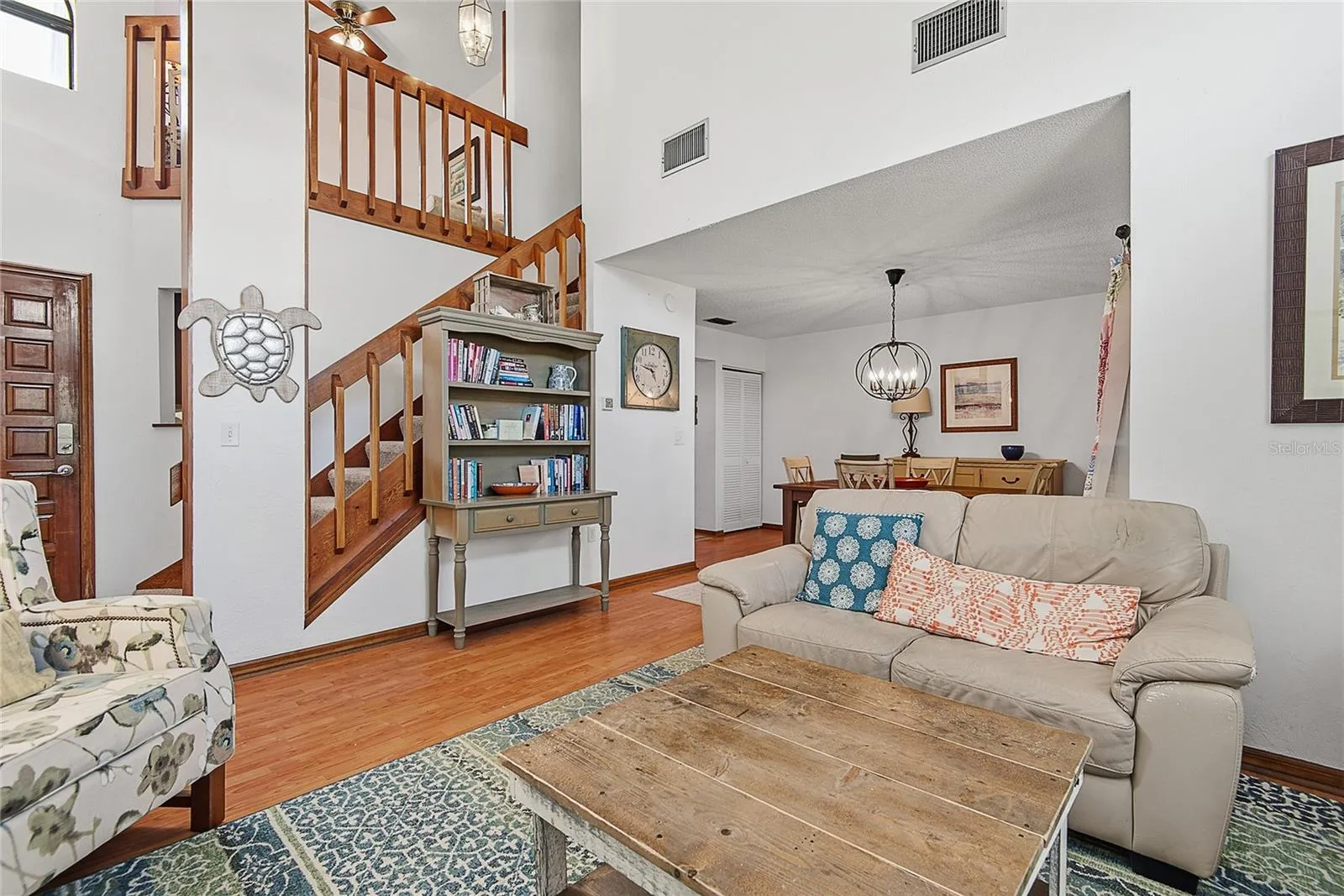 Living room view with staircase going upstairs