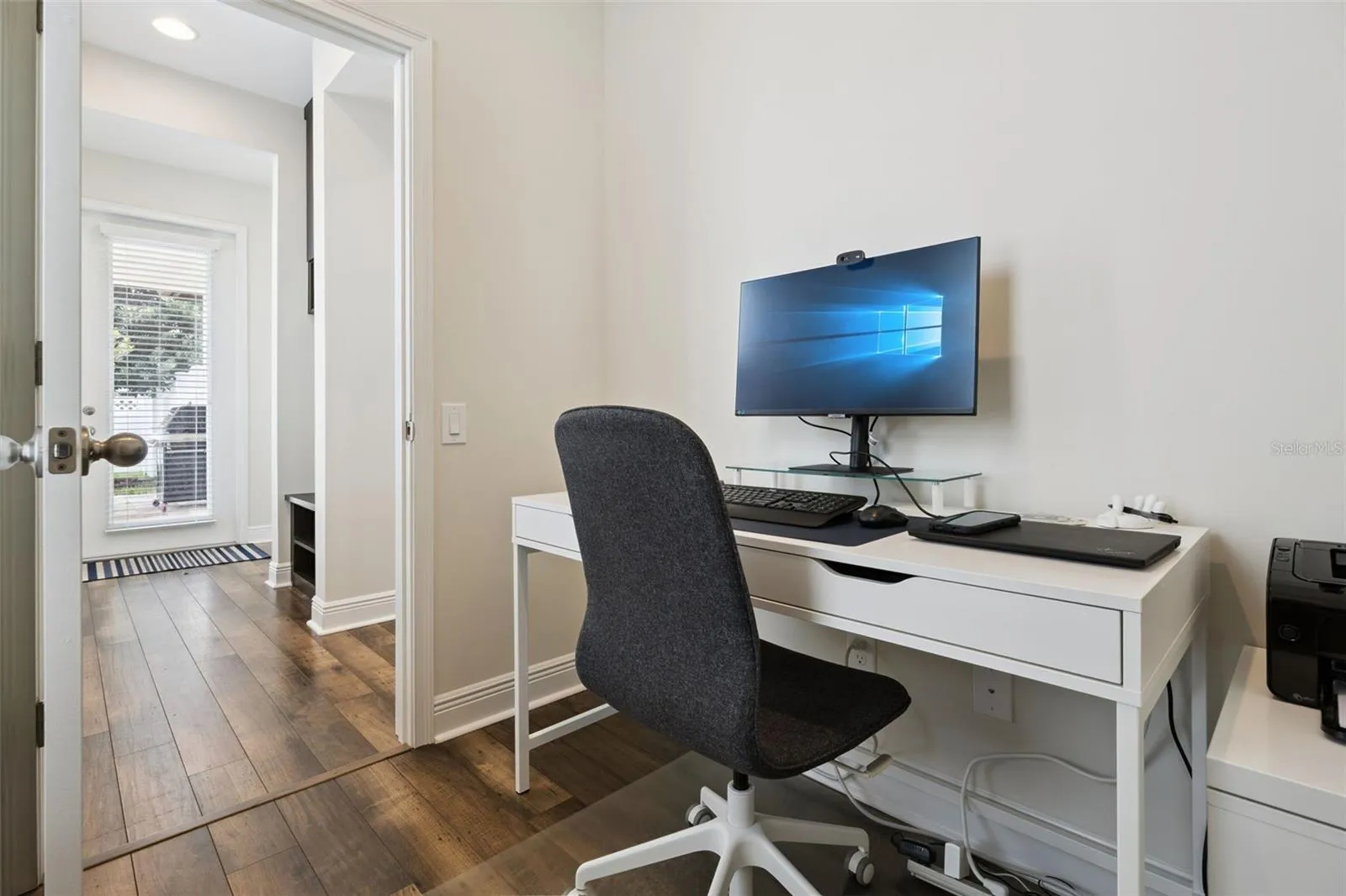 Downstairs mix-use room. Office, butlers pantry, pet room, or storage room