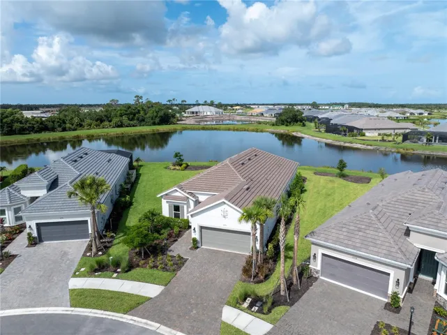 FRONT EXT WITH LARGE POND BEHIND