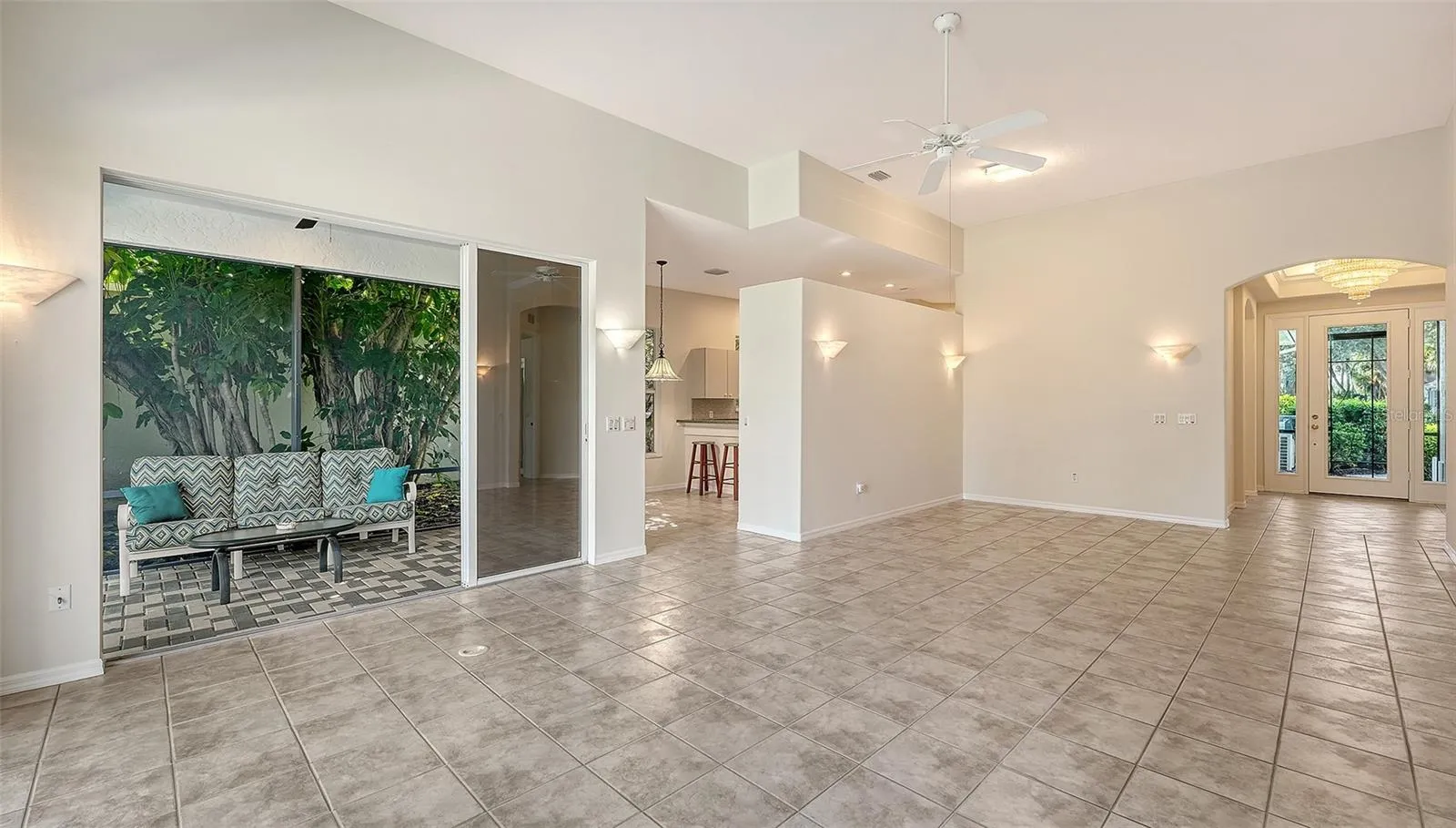 Open floor plan with sliding glass door to covered portion of the lanai