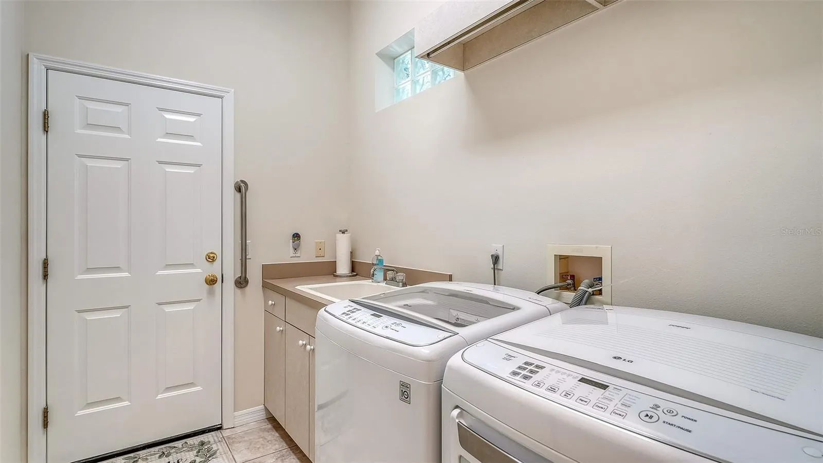 Interior laundry room with sink