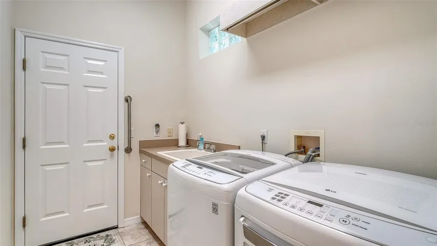 Interior laundry room with sink