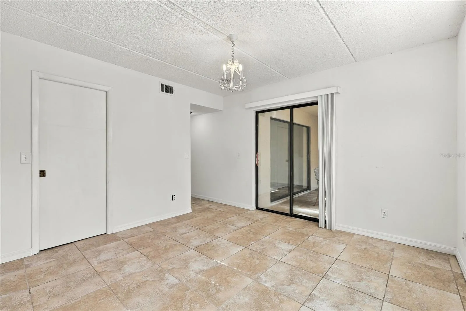 Primary Bedroom with Sliders to Back Patio