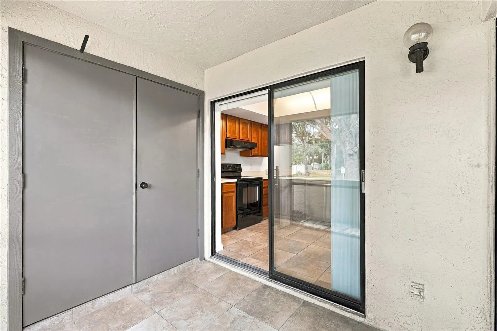 Front Screened in Patio with Laundry Closet
