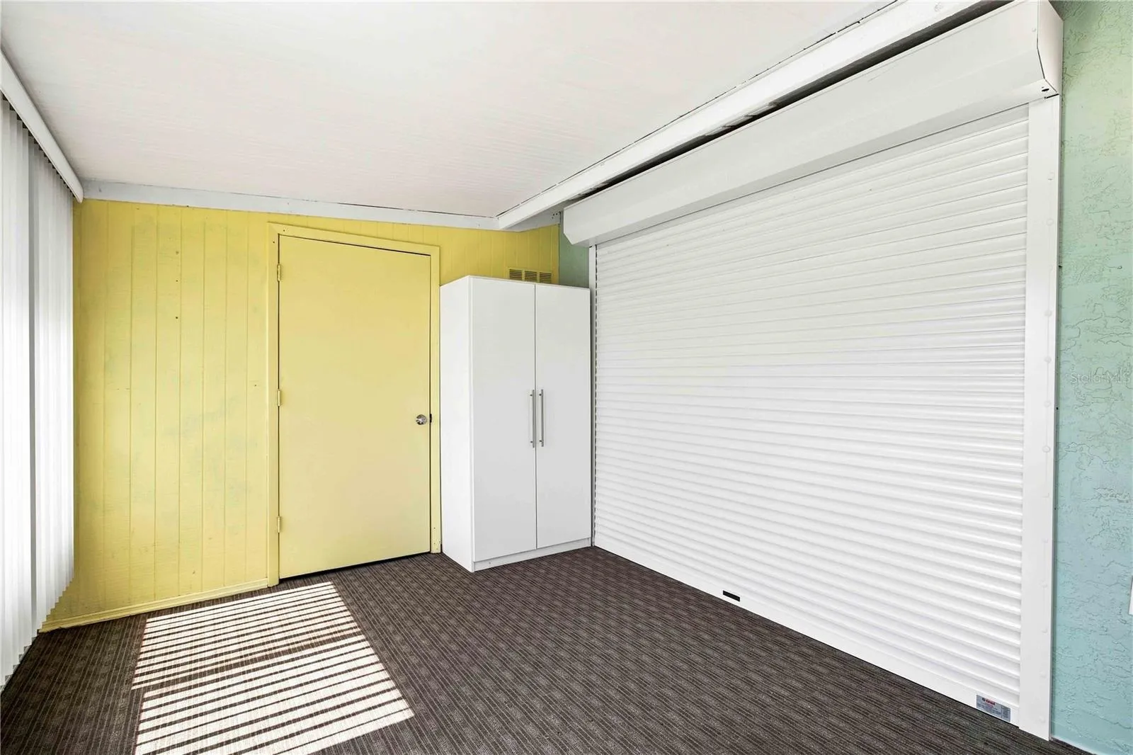 ELECTRIC/REMOTE CONTROLLED HURRICANE ROLL UP SHUTTER OVER LANAI SLIDER DOOR
