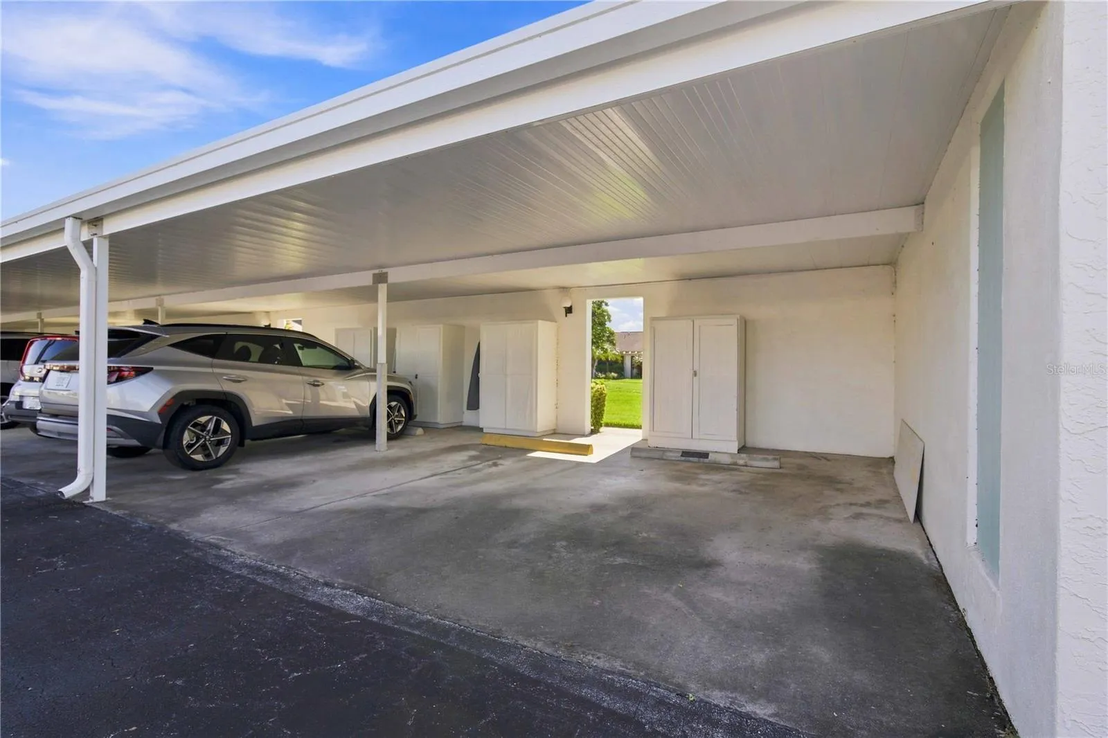 PRIVATE CARPORT SPACE WITH STORAGE CLOSET