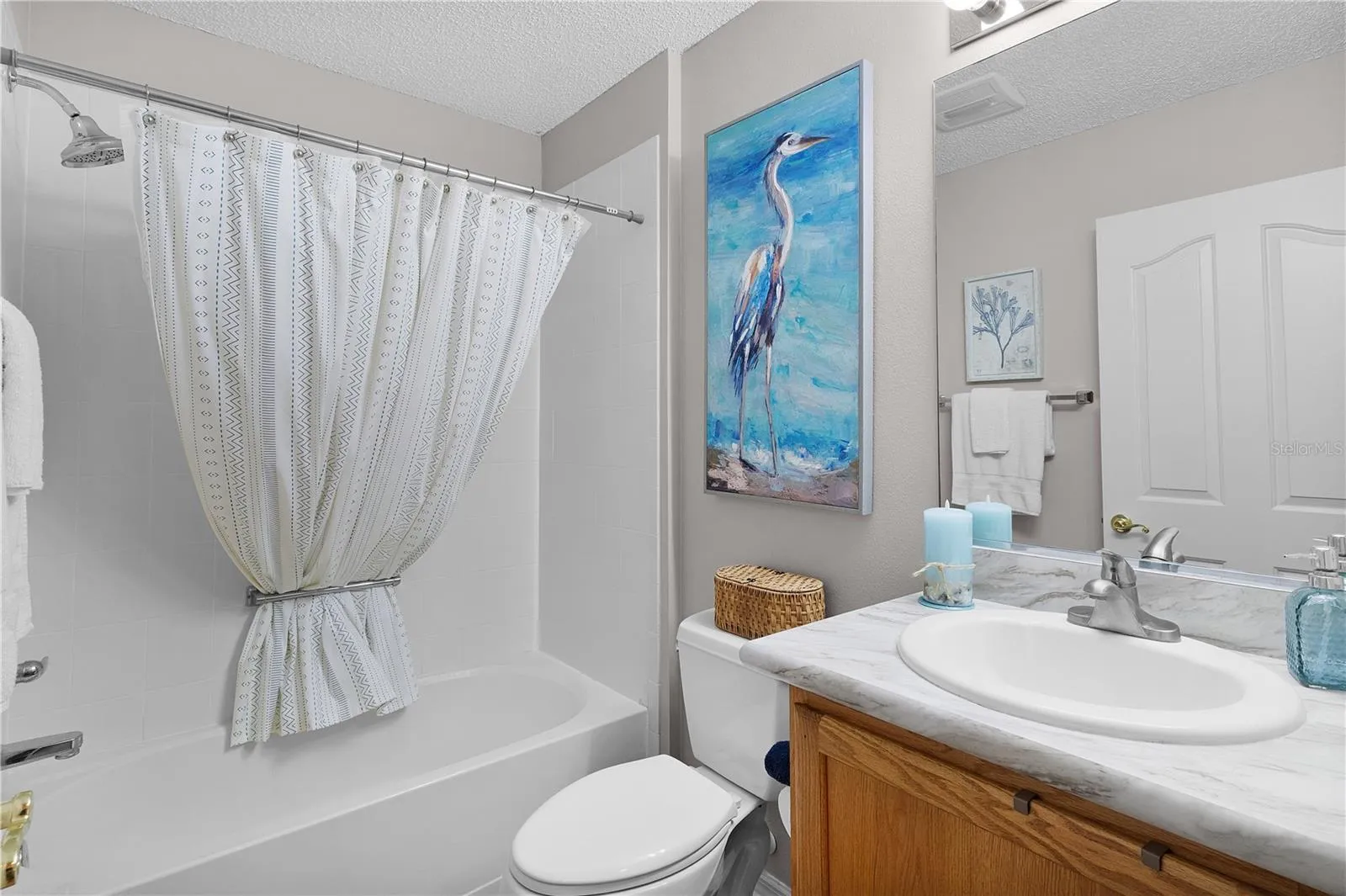 Guest bathroom with ceramic tile tub/shower combo