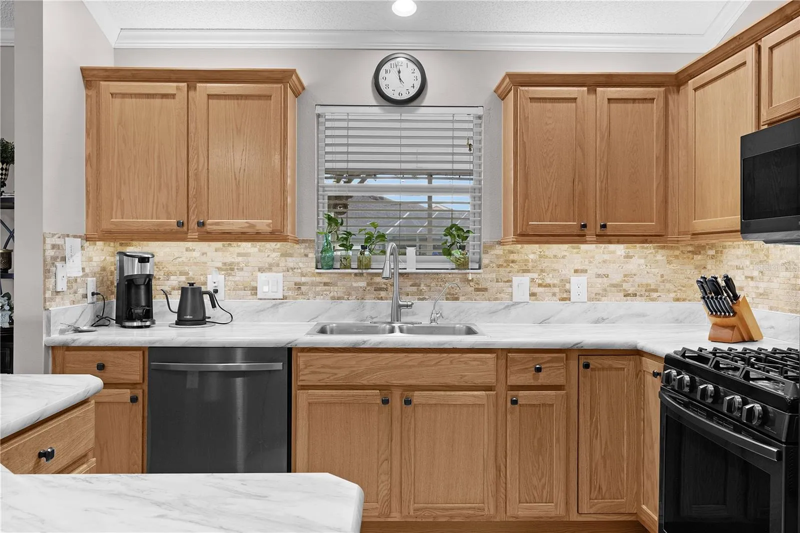 ceramic tile backsplash and under cabinet lighting