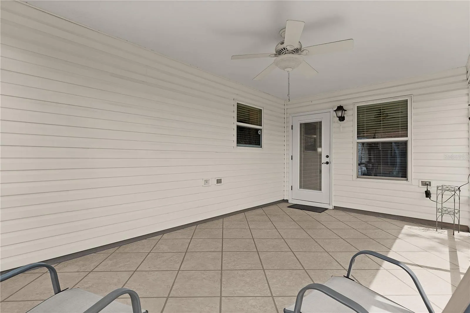 Ceramic tiled lanai with rear entry to the home