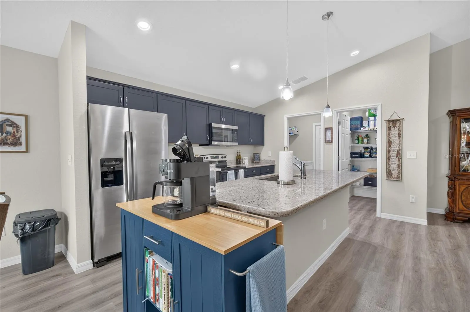 Kitchen with granite island and coffee bar