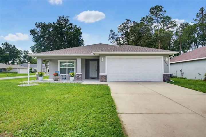 Concrete Driveway leads to Garage
