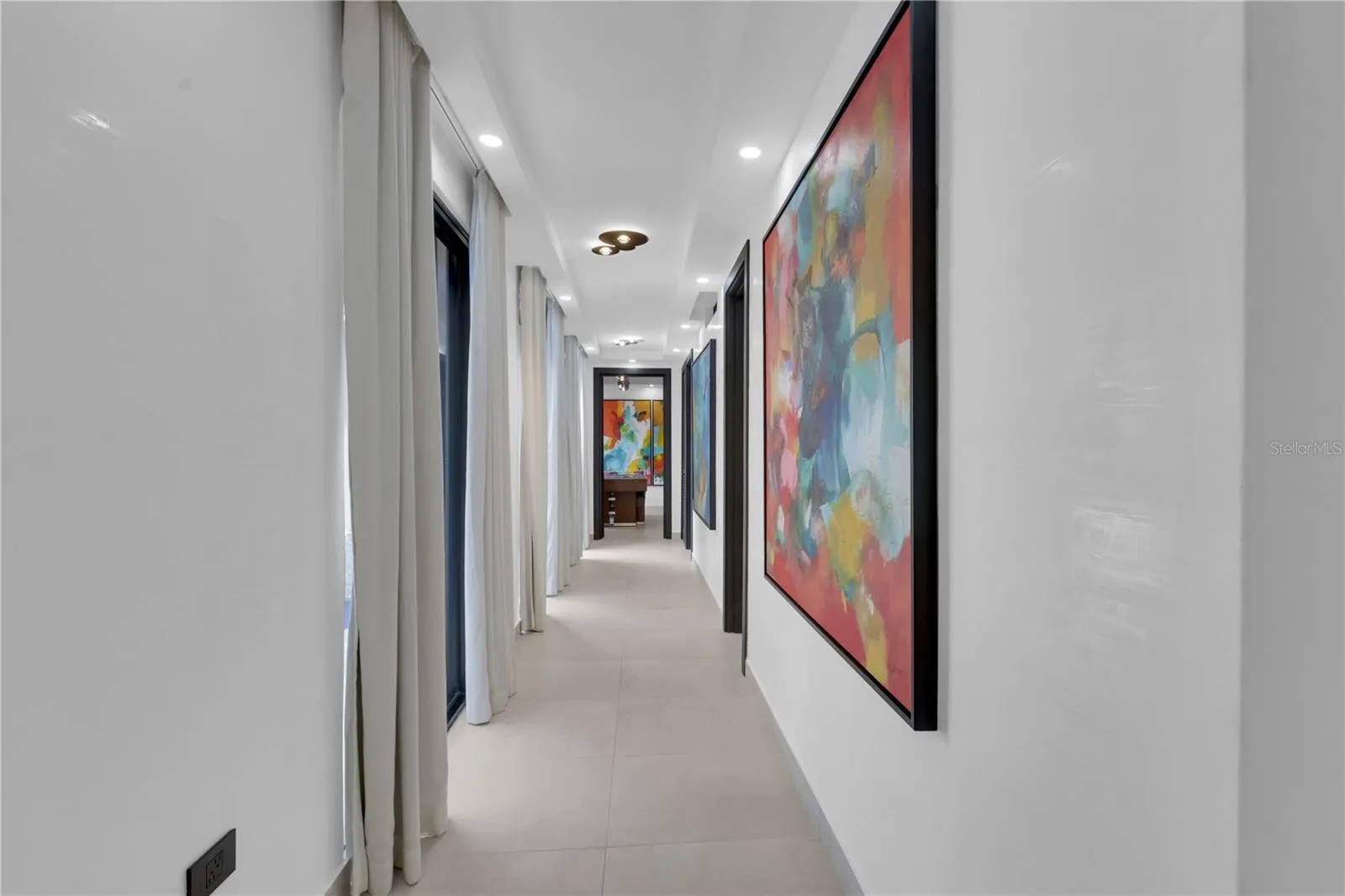 To the bedrooms, media room & more...