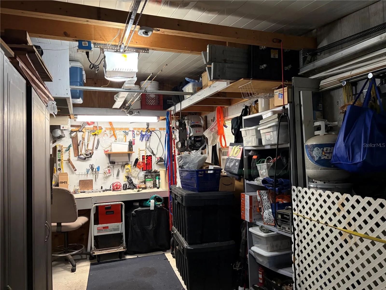 Garage showing workbench and storage