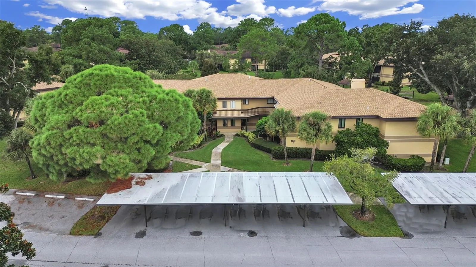 BEAUTIFULLY MANICURED COMMUNITY- COVERED CARPORT &amp; COURTYARD ENTRANCE