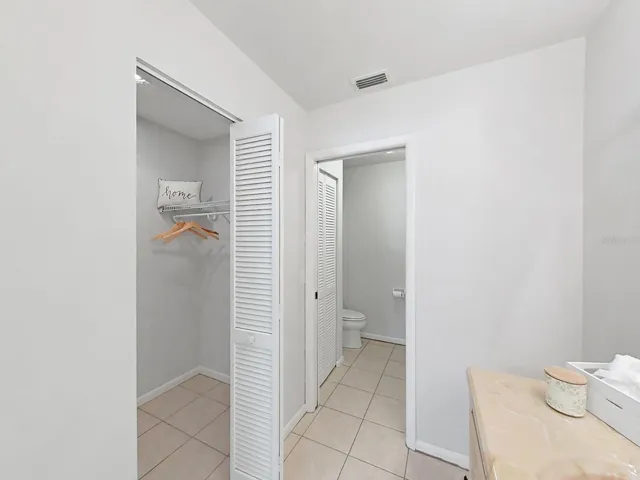 BEDROOM ENSUITE BATH- MULTIPLE CLOSETS &amp; PRIVATE TUB/TOILET AREA.