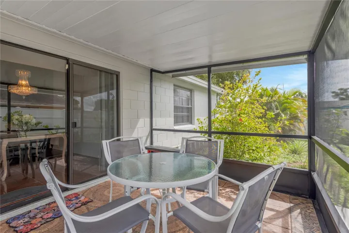 Covered Screened Patio looking toward Sliding Glass Doors off Dining Area