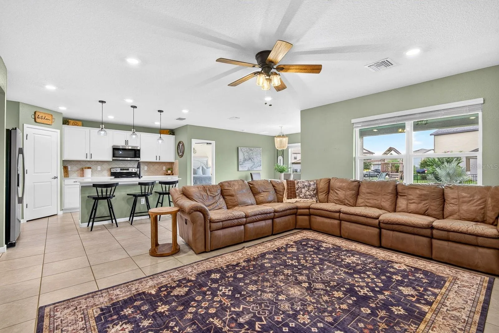 Living area facing open kitchen