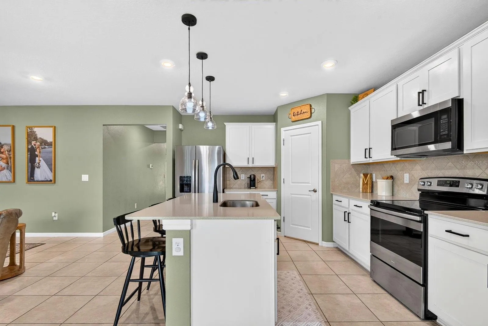 Kitchen featuring large island