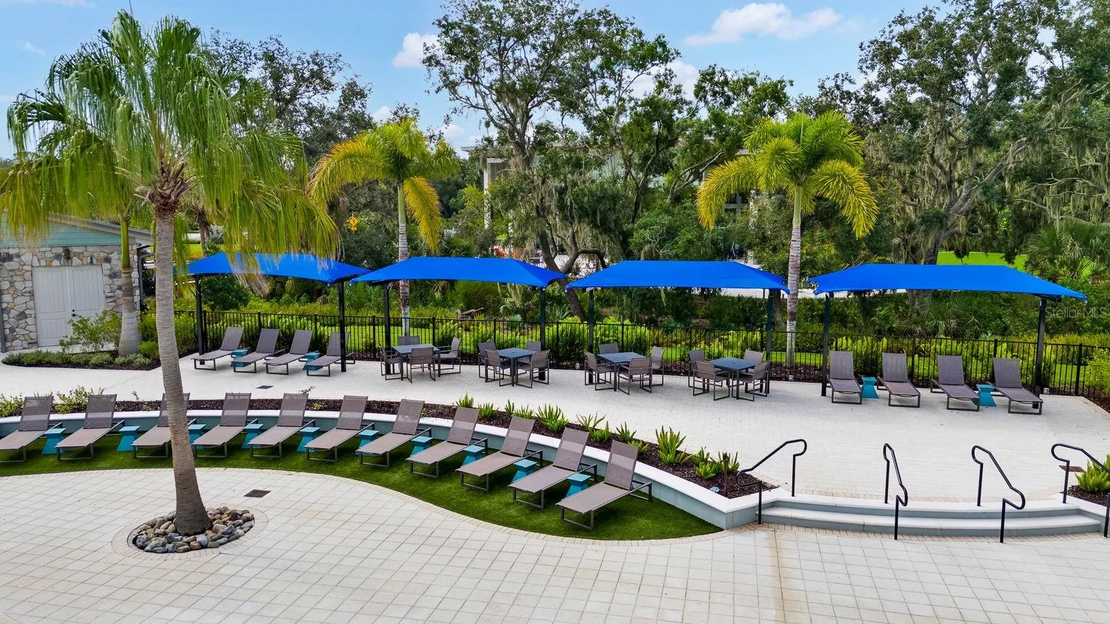 Plenty of sitting around the pool covered and uncovered