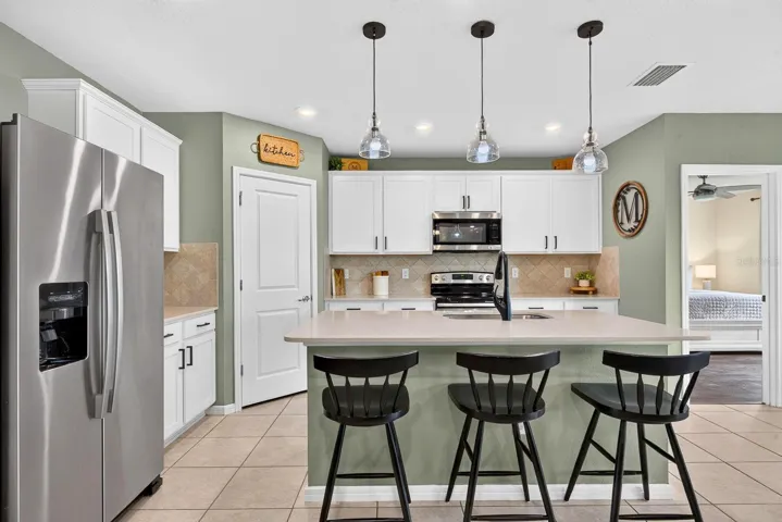 Facing into kitchen showing Master bedroom in the back of home