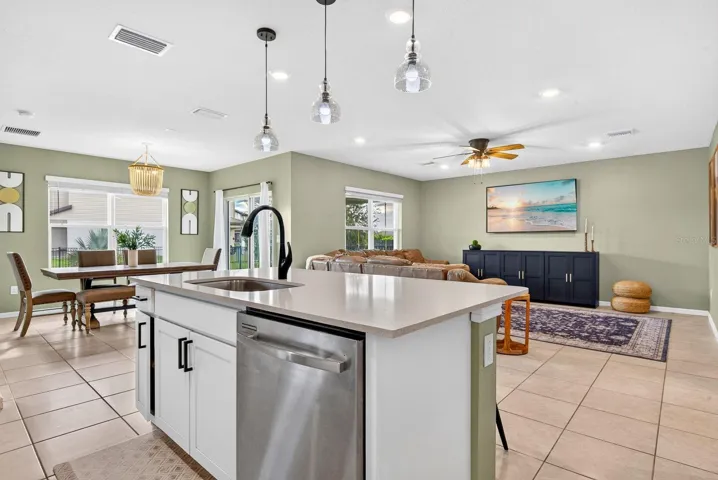 Wide angle facing into dining and living from kitchen
