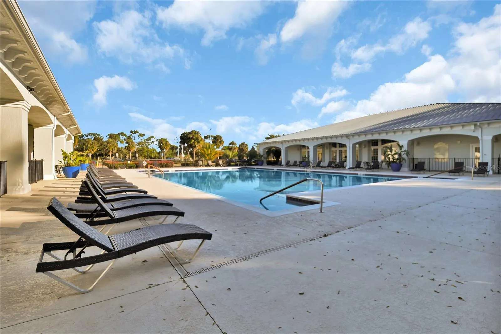 Palm Grove Large lap swimming pool area in Oak Run
