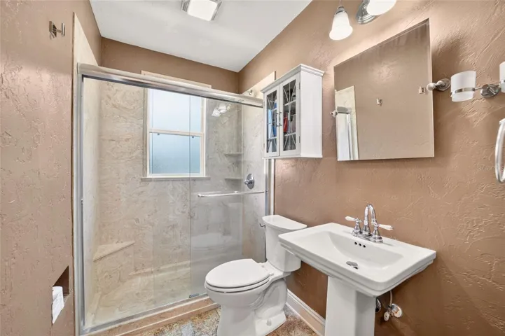 hall bathroom with walk in shower