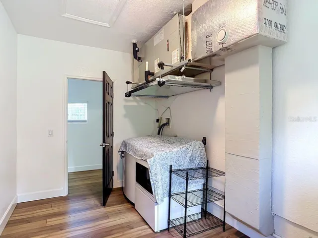 Laundry Room Conveniently Located Near Downstairs Primary Bedroom